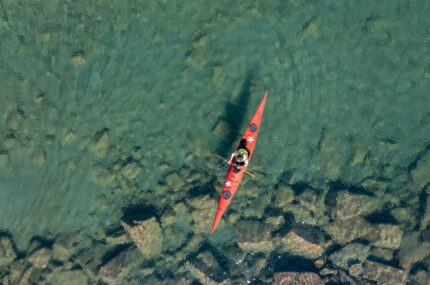 An overhead photo of a kayak on the water in Georgian Bay.